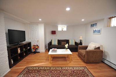 Comfy, cozy and clean basement apt with parking close to Harvard, Tufts and MIT.