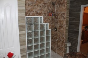 The master bathroom has a walk in shower handicap for wheel chairs and walkers.