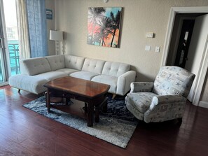 A couch and a foosball table offers comfort and fun, with serene ocean views