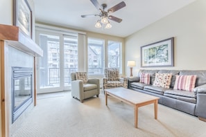 Living Area - Natural lighting brought in through the large balcony doors and windows.