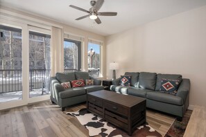 Natural lighting brought in through the large balcony doors and windows.