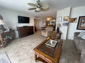 Cabinet style Murphy bed under the tv gives the unit 1 extra queen bed