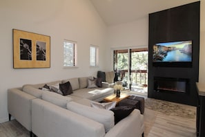 Relax on our over-sized sofa basking in the warm-glow of our electric fireplace.