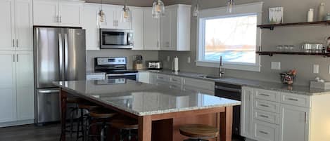 Kitchen with granite countertop and 4'x8' island.