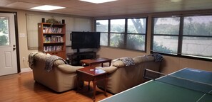 Sun room with Ping Pong table, movies, and games.  Perfect hangout. 