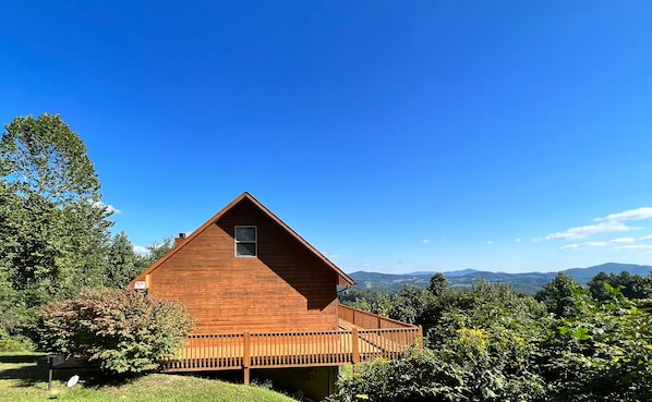 Enjoy long range mountain views from the wraparound deck at Above It All.