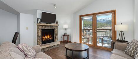 Living room - Top floor views from living room w/flat screen TV, and gas fireplace