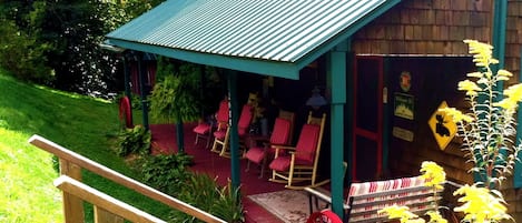 Welcome to a Creek-side Cedar Cabin in pastoral mountain setting on a country rd