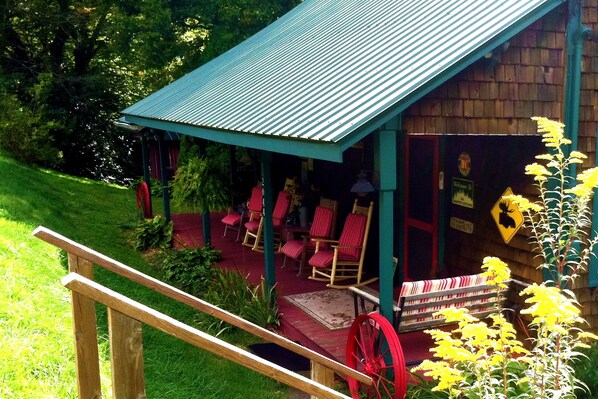 Welcome to a Creek-side Cedar Cabin in pastoral mountain setting on a country rd