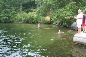 Shallow swim area accessible from patio via steps or shoreline