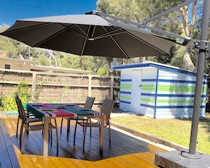 Outdoor setting with shade from large umbrella