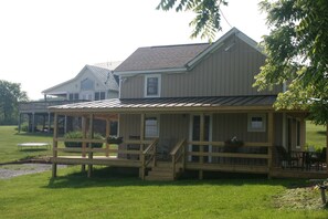 Aunt Judy's Front Porch; parking to left and Farm Cottage far left