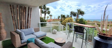 Spacious patio with new comfy seating and bar offering gulf and sunset views