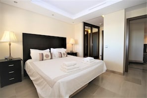 Beautiful master bedroom with super king size bed, air conditioning and en-suite bathroom
