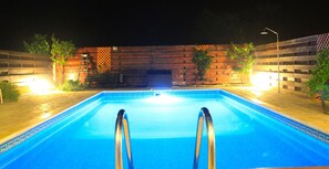 Illuminated Pool By Night