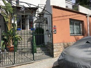 Front Entrance behind security bars, front foor to apartment first right.