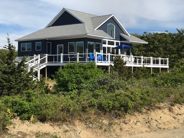 Faces beach, with a large wrap-around deck.