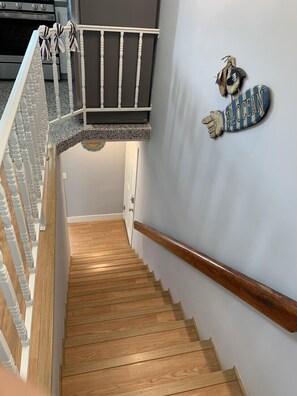 Stairs leading down to Entry door, bedrooms and garage