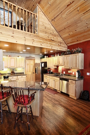 Kitchen with new hard wood floors and granite countertops