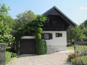 the front side of the chalet with a safe parking behind the fence 