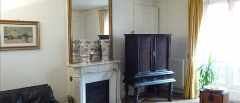 Salon w/Haussman Elegance-marble fireplace, ceiling mouldings, parquet floors.