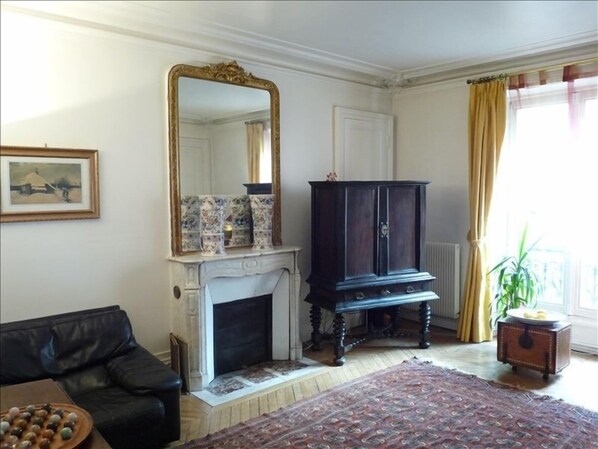 Salon w/Haussman Elegance-marble fireplace, ceiling mouldings, parquet floors.