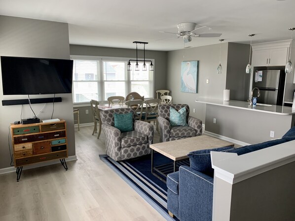 Roomy living room and dining area. Brand new flooring throughout.