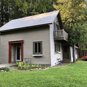 Side of house with main entrance door.