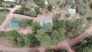 Aerial view of spacious, private acre fenced property. space to explore & relax 