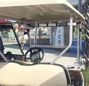 Golf cart with parking sticker is perfect to go to the beach or explore