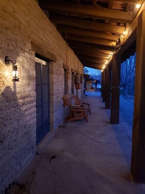 The porch at dusk. A century of serenity and relaxation.