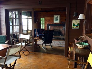 Porch opens to living room (double French doors)