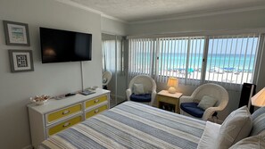 The bedroom features a 40” Smart HDTV, extra seating, and a spacious closet.