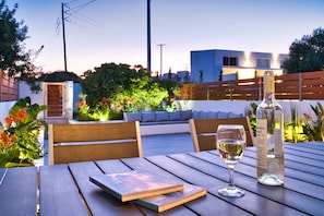 Enjoy a glass of wine or a dinner at the private space of your backyard 