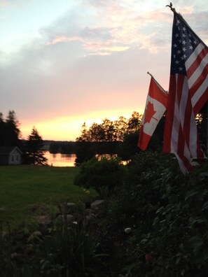 Maine House looking down at the water at sunset