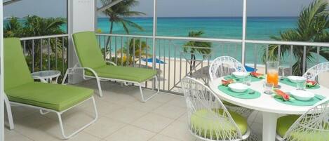 The terrace with expansive beach and sea view south towards Georgetown