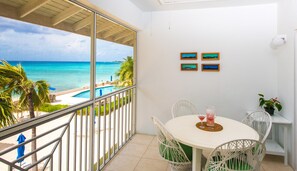 Terrace dining and view towards swimming pool.