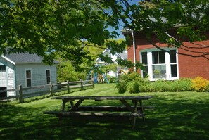 Over-sized picnic table with new tablecloths.