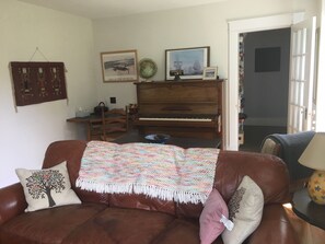 Large and sunny living room. Big windows facing south. Comfy seating.