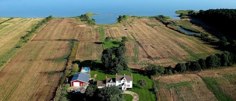 Property grounds: BB court, house, barn, pool and grass volley ball court.