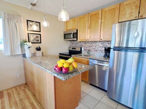 Fully equipped kitchen with tropical flair.