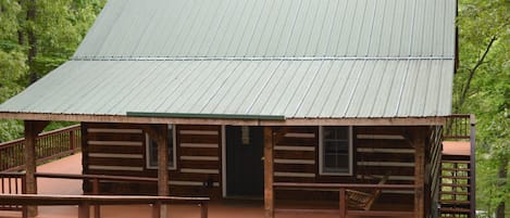 front entrance with wrap around deck and porch swing