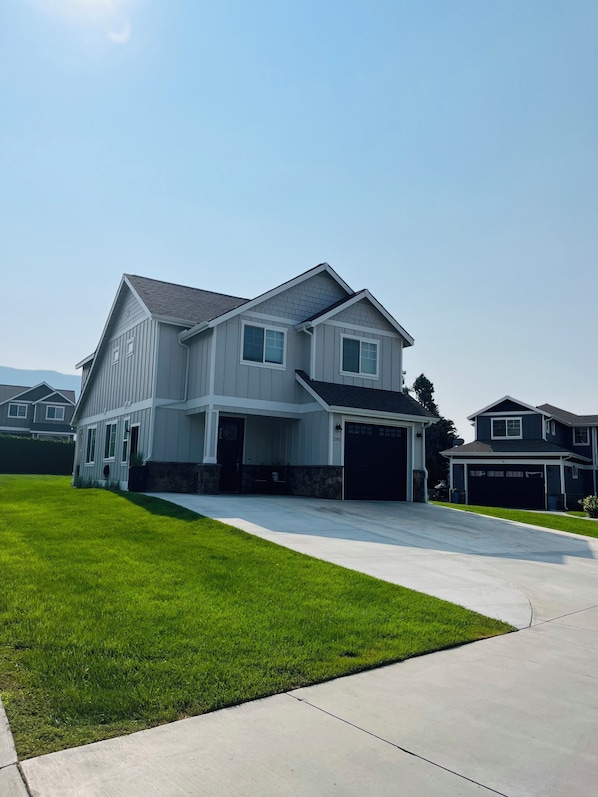 Extended driveway to fit two cars and boat