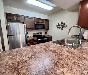 A chef's dream kitchen featuring high-end finishes and plenty of prep space.