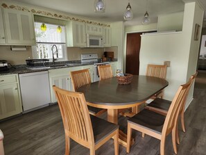 Kitchen table (w leaf), dining chairs for 8,
updated appliances