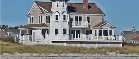 View from water.  The beach is beautiful white sand and the water is warm!