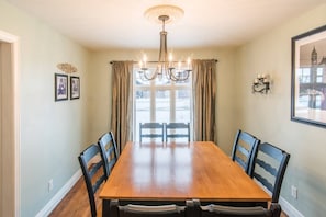 The elegant farmhouse-style dining room is the perfect spot to enjoy dinner while planning your next day’s activities. The dining room seats 8, as does the kitchen table and bar seating.