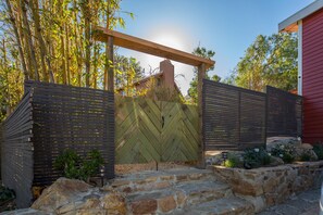 WELCOME This is the front gate, crafted with reclaimed wood from the site.