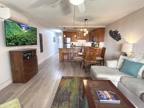 Experience island comfort in this stylish living room, where Hawaiian-inspired decor and cozy furnishings invite you to unwind in paradise.
