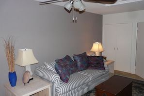 3rd bedroom/den with foldout couch. Flat screen TV. Ceiling fan.